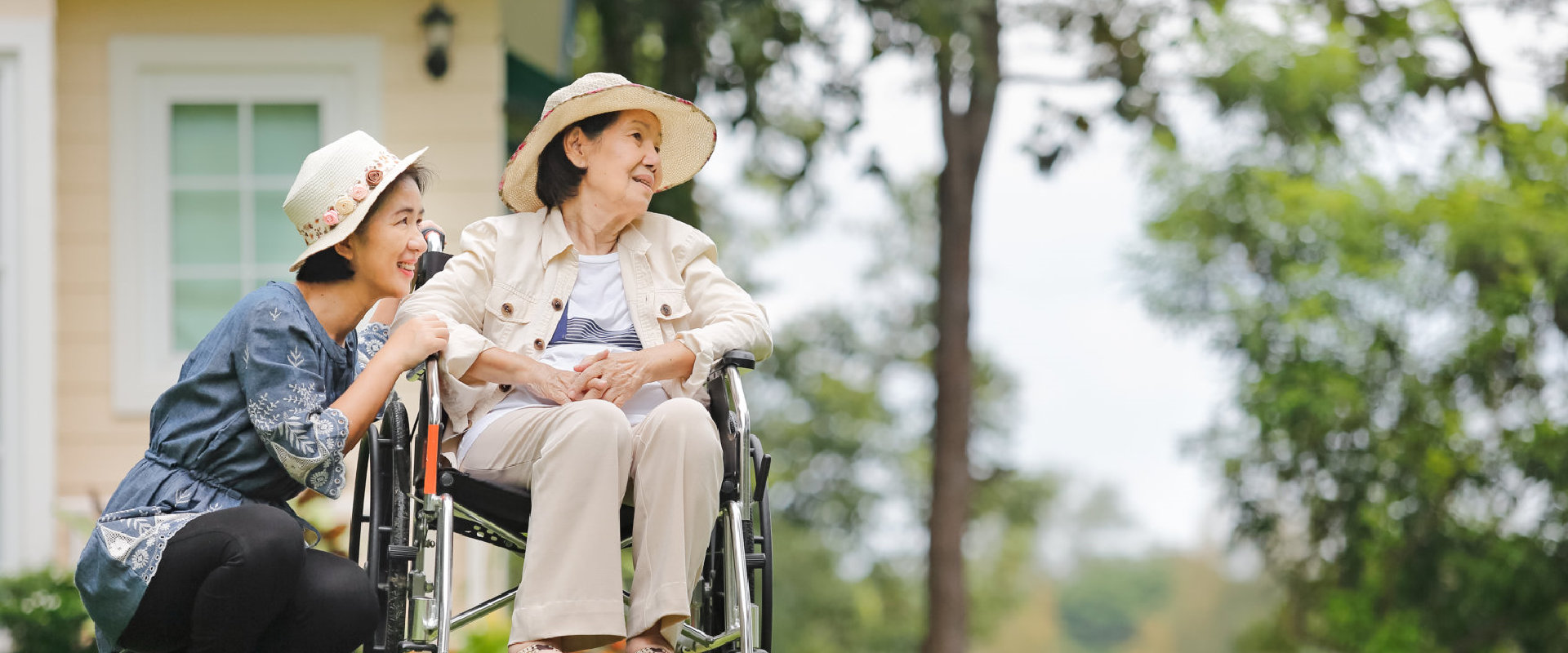 caregiver and senior woman at the park