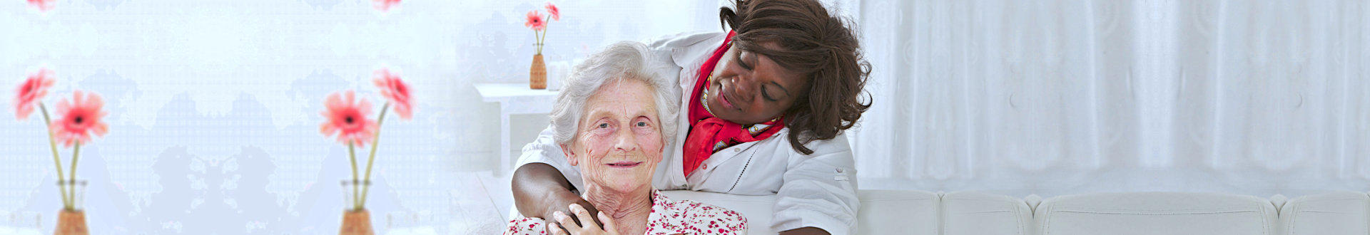 elderly woman smiling with a nurse on her back