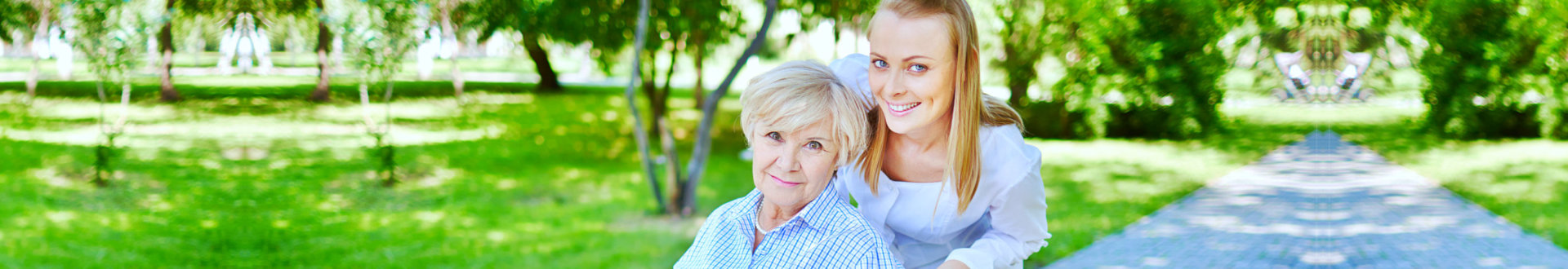 elderly woman with her caregiver smiling